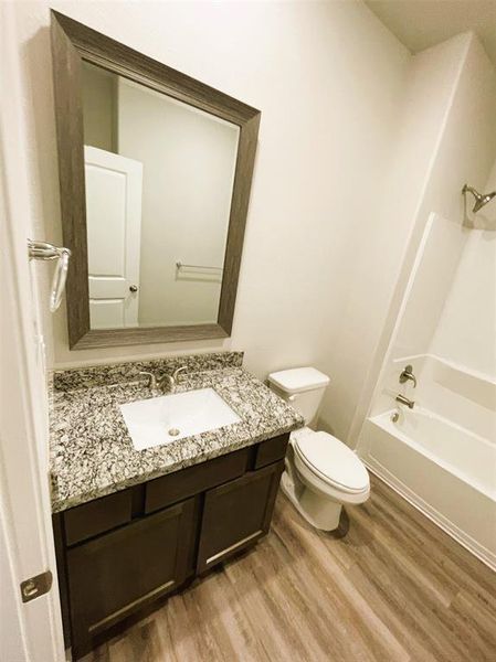 Bath 2 has granite counters & stylish framed mirror!