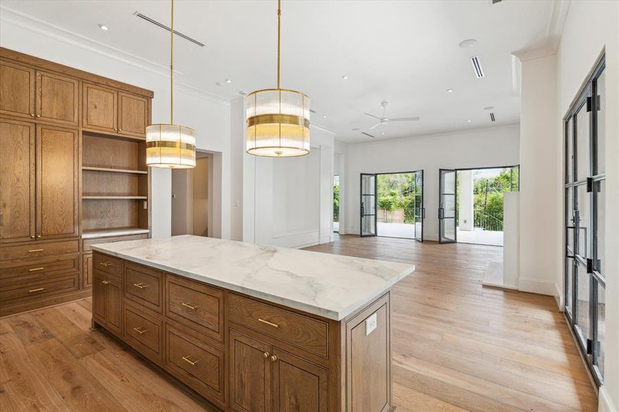 Equipped with premium SubZero Wolf appliances and gorgeous white oak cabinetry, this kitchen is designed for both functionality and beauty. The dual islands, topped with sleek Dekton quartz, provide plenty of space for entertaining and everyday living.