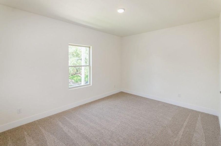 Unfurnished room with carpet flooring