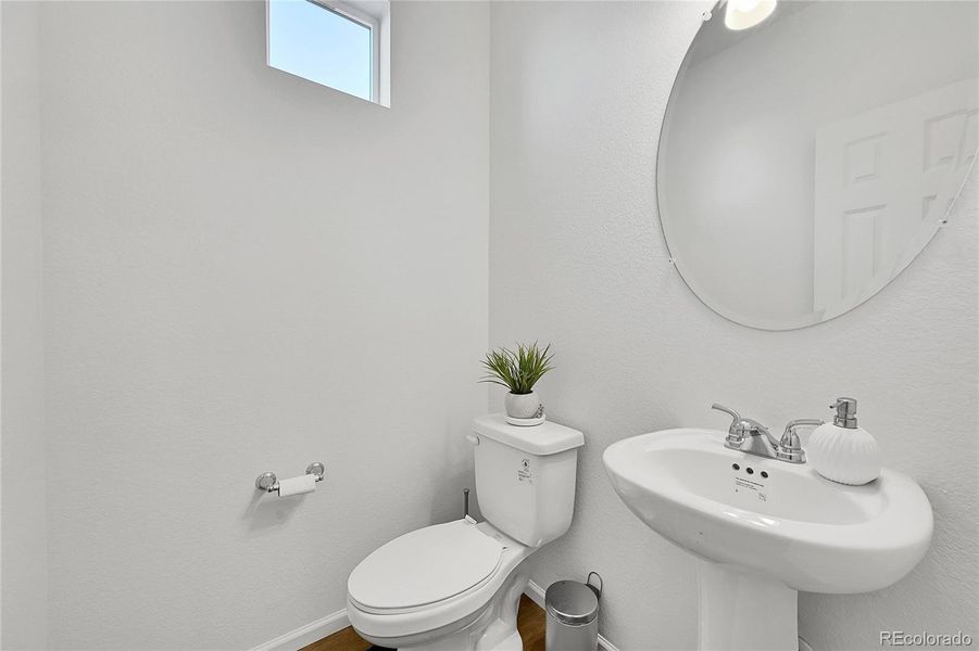 A powder bathroom is perfectly placed on the main level, convenient for guest use!