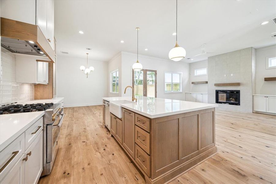 The kitchen is complete with a large gas range with griddle and professional grade vent hood complimented by a apron front sink. All doors and windows in this home are wired for motion sensor security system