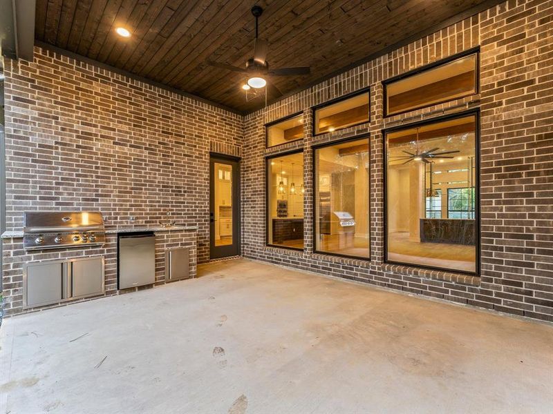 Outdoor Kitchen at Covered Rear Patio with Fan