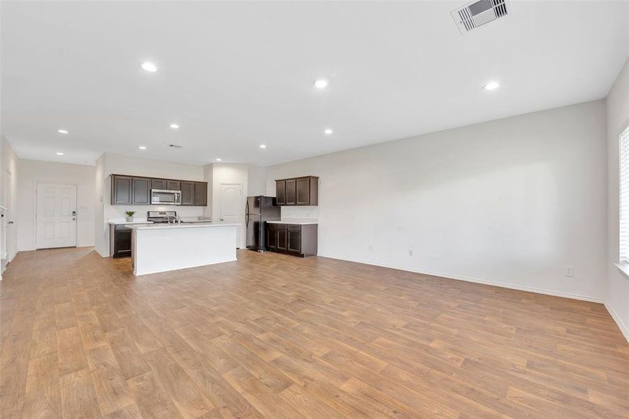 Another view of the open living room and kitchen.