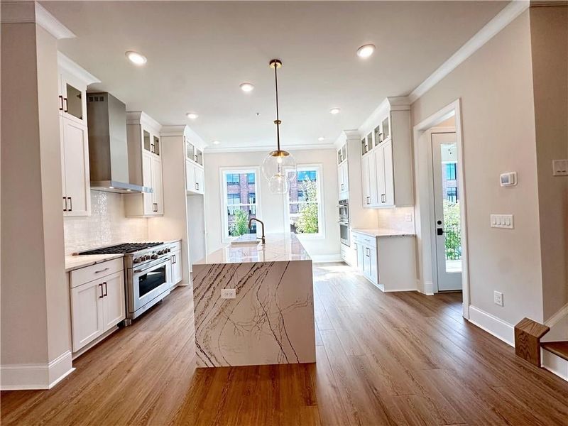 Gorgeous waterfall, quartz Island, elegant with your white cabinetry to the ceiling