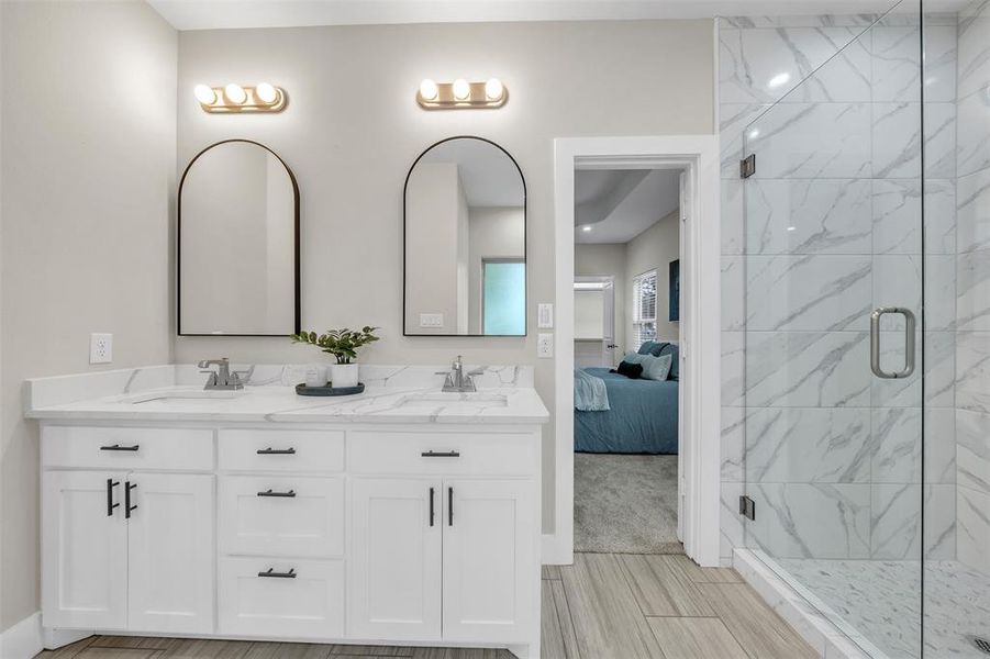 Master Bathroom with walk in shower and dual vanity