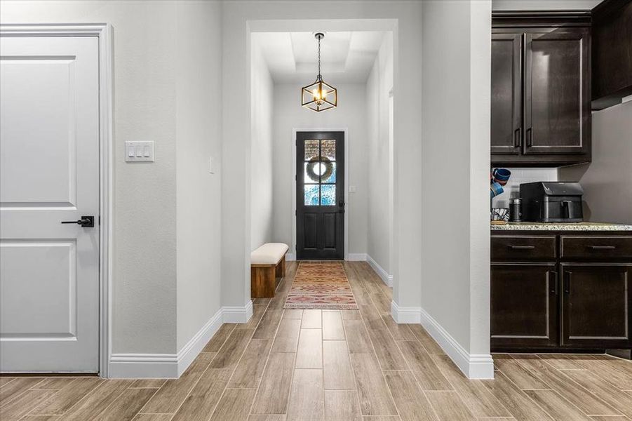 Entrance foyer featuring light hardwood / wood-style flooring