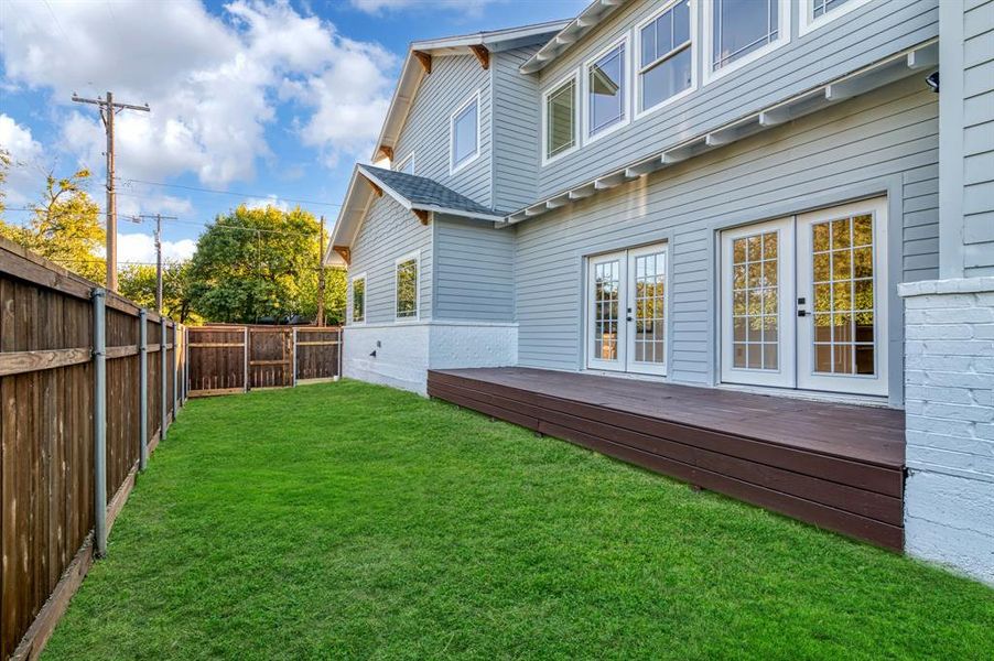 View of yard with a wooden deck