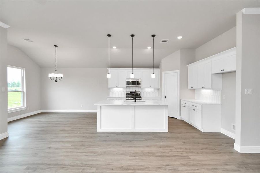 Open concept kitchen with kitchen island