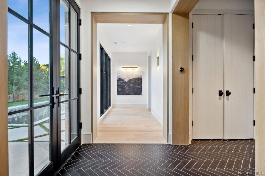 Oak trimmed hallway to primary suite