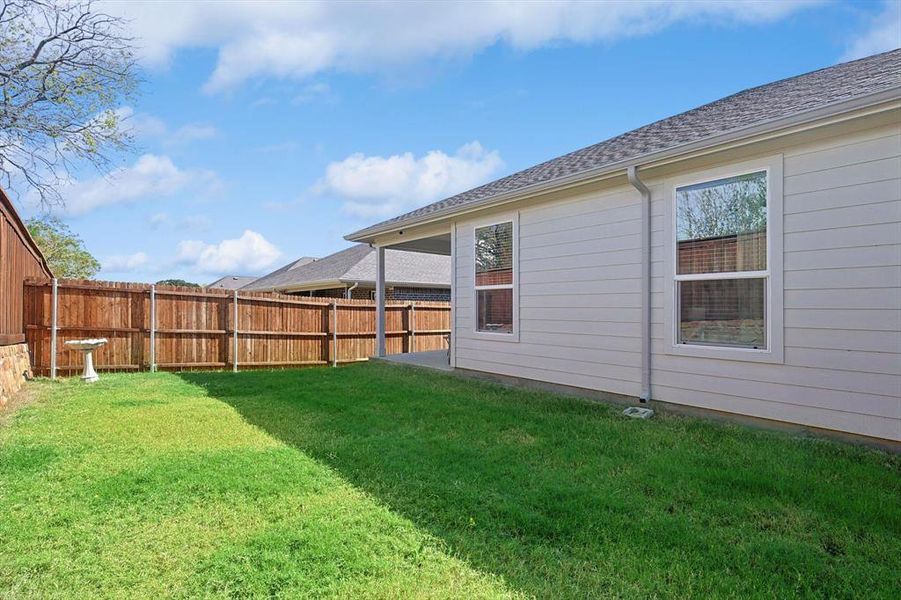 Large backyard with higher privacy fencing, no neighbors behind- just trees