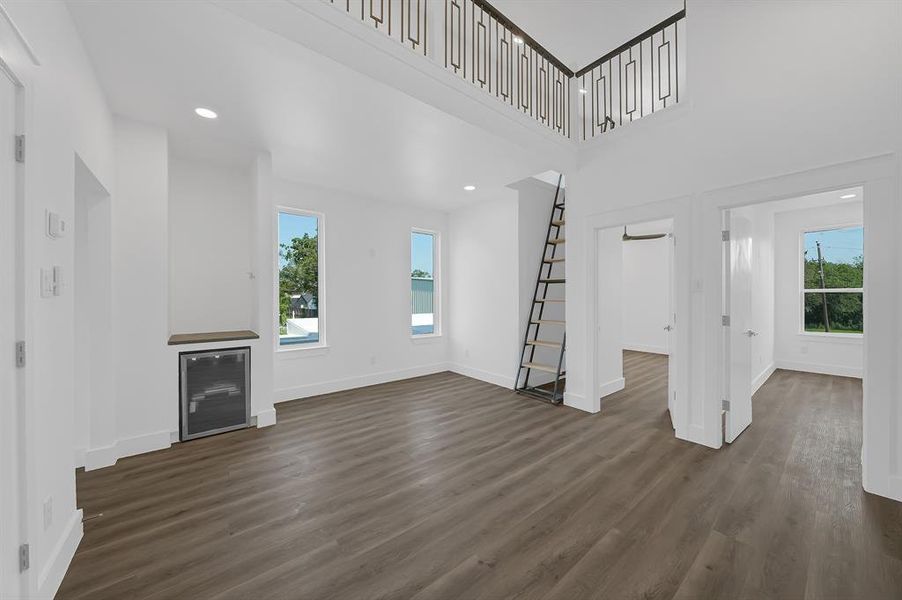 Loft space with matching balusters overlook the game room.