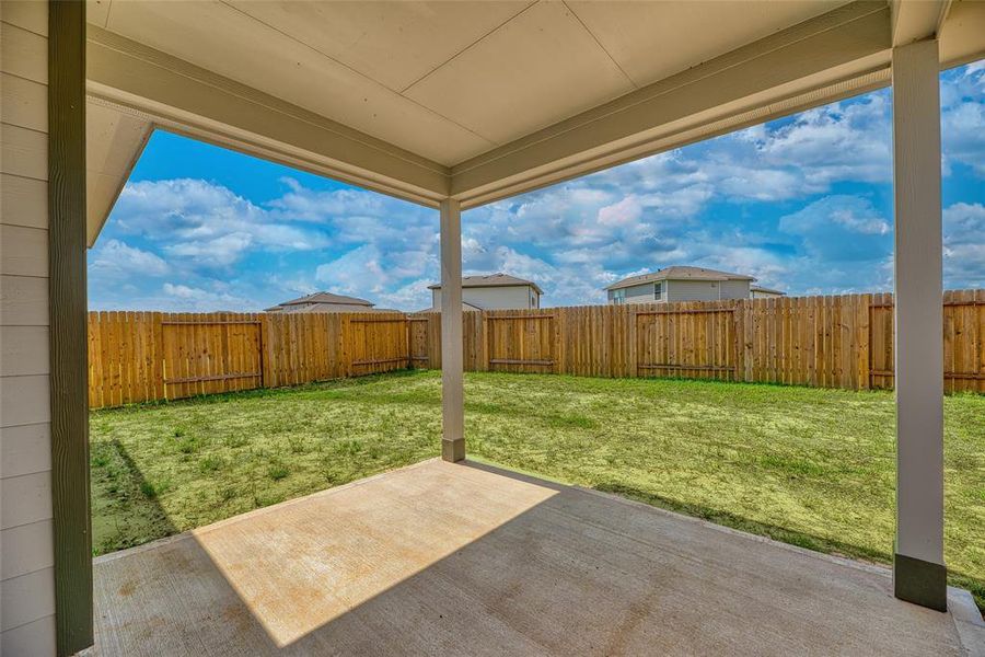 Step outside onto the covered patio that overlooks the backyard, offering a blank canvas for creating your ideal outdoor paradise. There is ample space for pets or children to play safely within the confines of the fenced-in yard, ensuring both security and peace of mind.