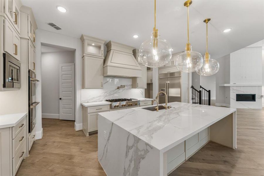 -- Representational Photo -- Another view of this sensational, spacious Kitchen with a fabulous two-story Family Room just beyond it with a linear fireplace as a focal point.