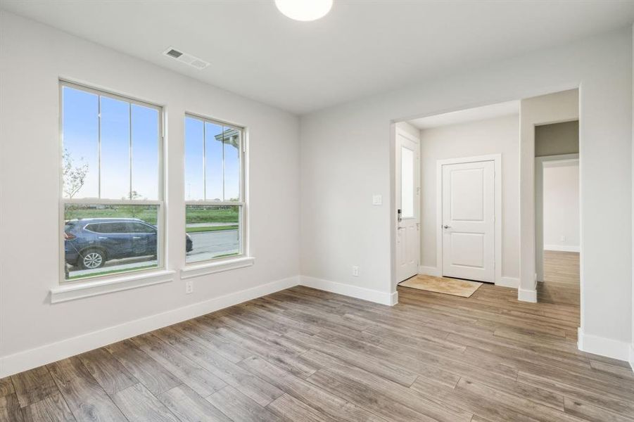 Unfurnished room featuring light wood-type flooring