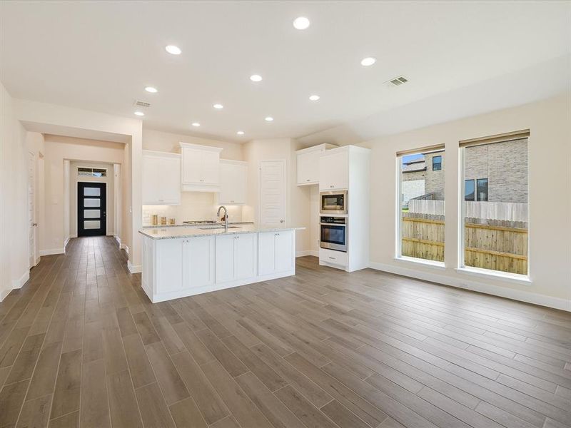 Another view of the kitchen and entry. Great natural light!