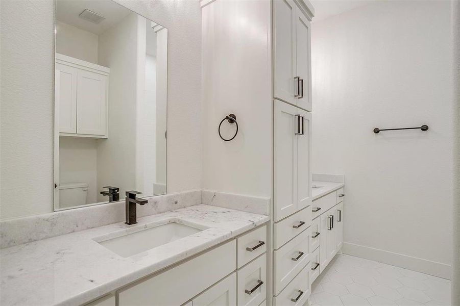 Guest bathroom with dual vanities