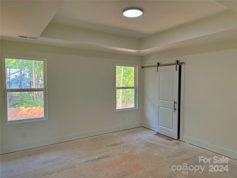 Owners Suite with Tray Ceiling Upstairs with Barn Door