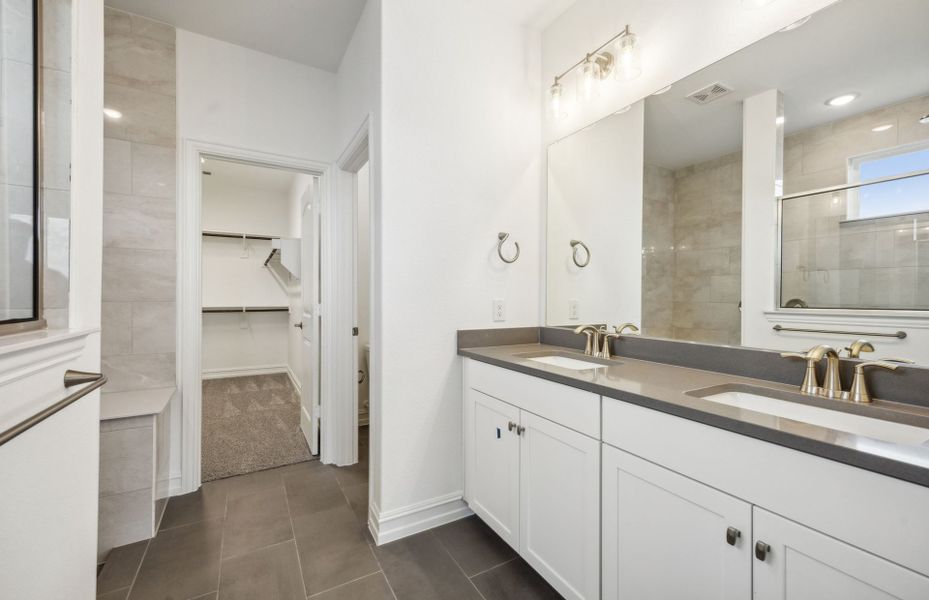 Elegant owner's bathroom with dual vanity