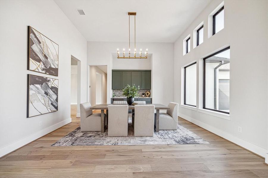 Dining room with butler's pantry, perfect for serving guests or using as a bar.