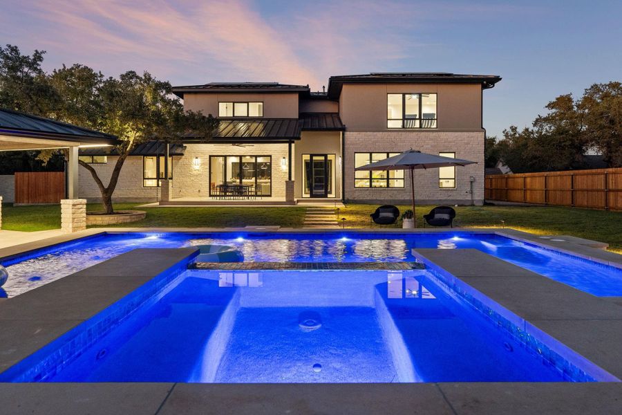 Jacuzzi and pool, with a pool house and stunning evening light.