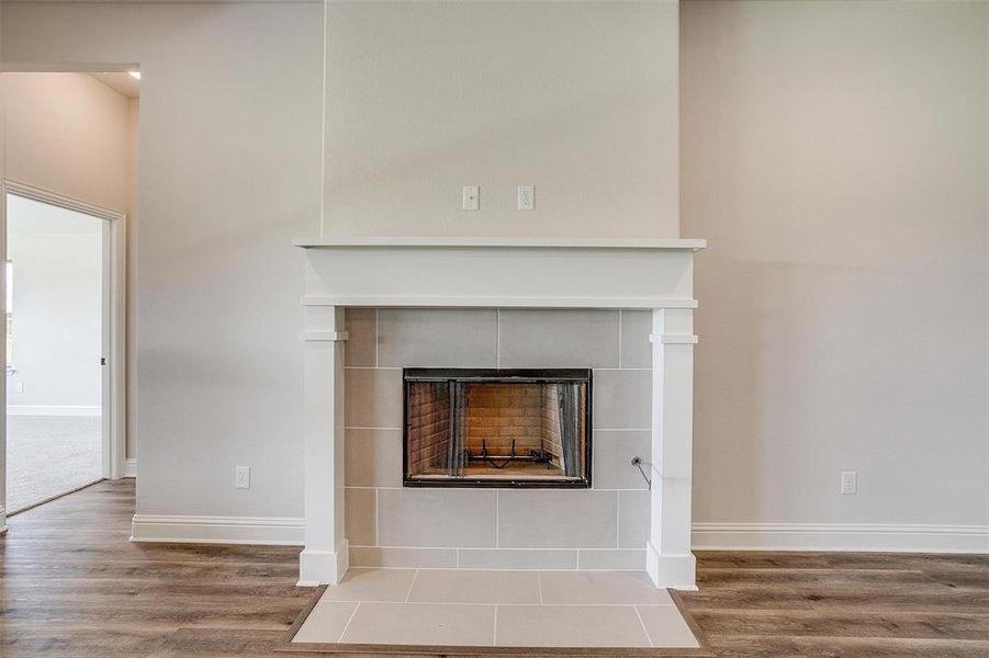 Interior details with a fireplace and hardwood / wood-style floors