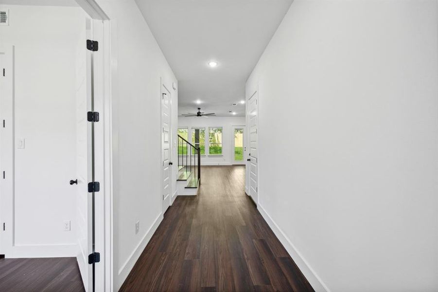 Corridor featuring dark hardwood / wood-style floors