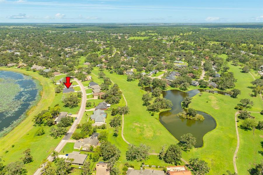 View of the greenspace and lagoon. Golf cart, bike or walk along the golf cart path.  Catch and release fishing in the lagoons.  There are many throughout the neighborhood!