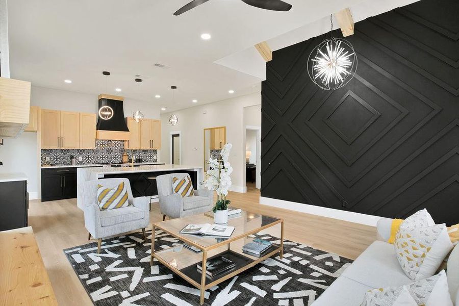 Living room with light wood-type flooring and ceiling fan