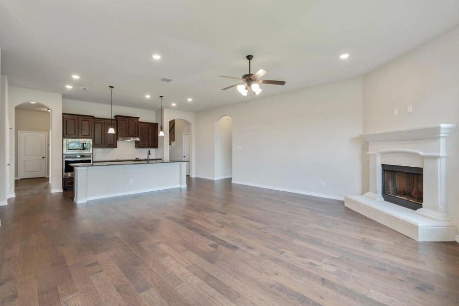 Family Room to Kitchen | Concept 2671 at Oak Hills in Burleson, TX by Landsea Homes