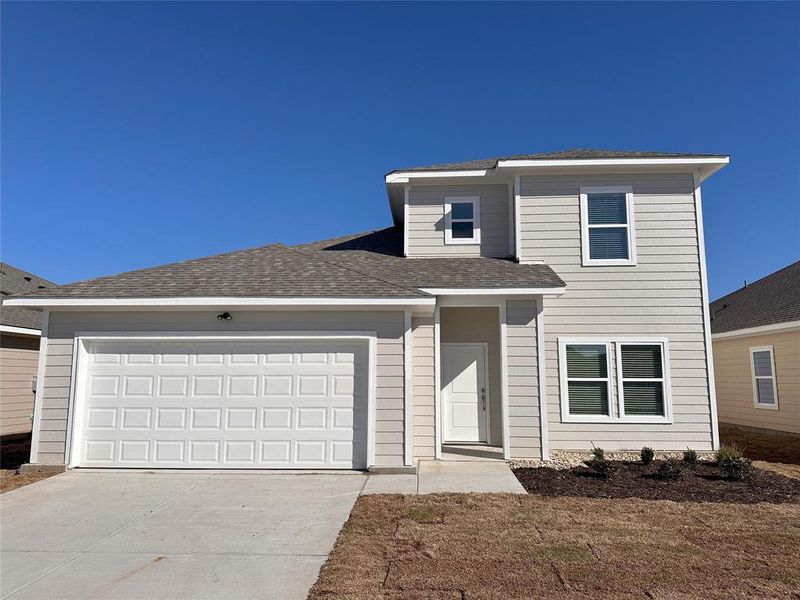 View of property with a garage