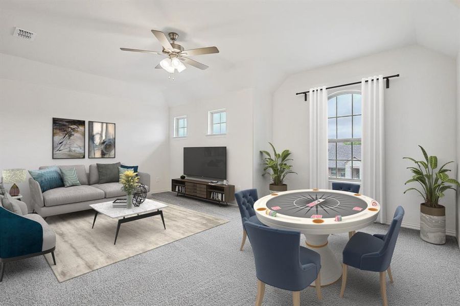 Recreation room featuring carpet, ceiling fan, plenty of natural light, and vaulted ceiling