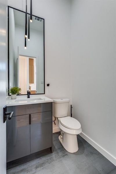 Bathroom with toilet and vanity