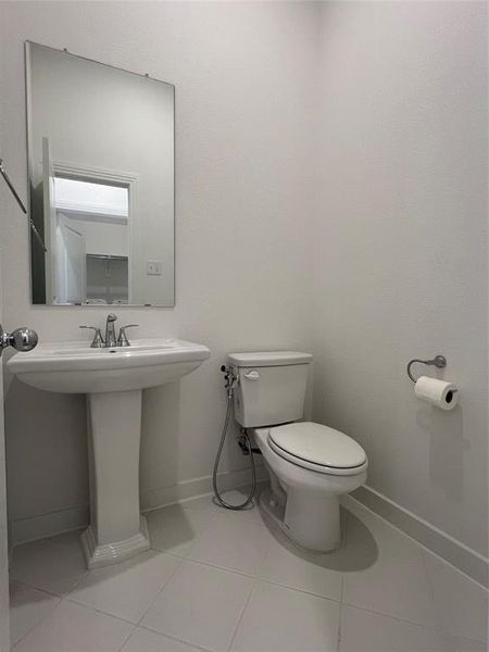 Bathroom with tile flooring and toilet