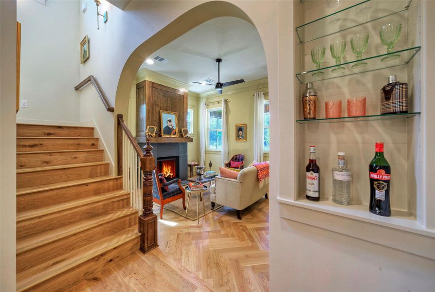 Built-in bar niche and antique newel post add to the warmth.