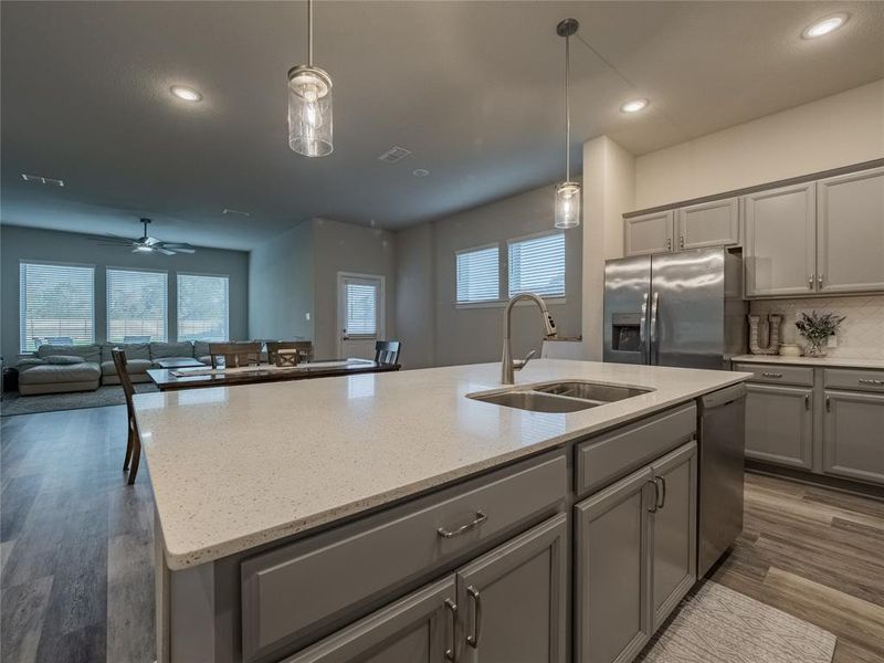 island with granite counter tops and double sink