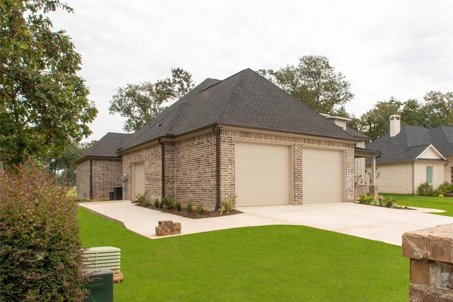 Front showing golf cart garage entrance.