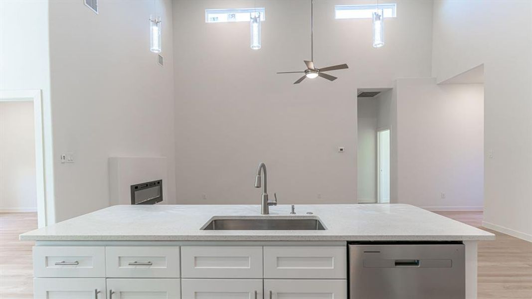 Kitchen island with sink, dishwasher and granite top