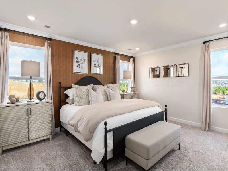 The primary suite features a luxurious walk-in closet.