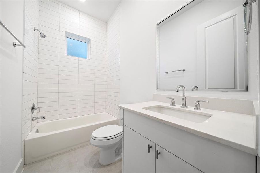 tail to the ceiling in the bathrooms, beautiful hardware, and framed mirrors.