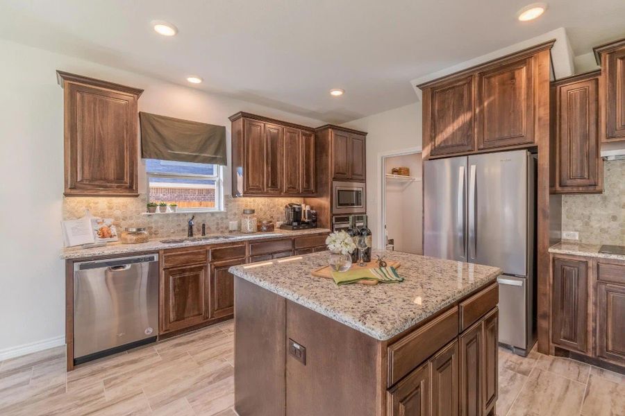 Kitchen | Concept 2379 at Abe's Landing in Granbury, TX by Landsea Homes