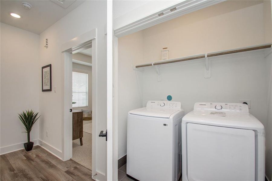 The laundry area is conveniently located on the second floor! Model home photos - FINISHES AND LAYOUT MAY VARY!