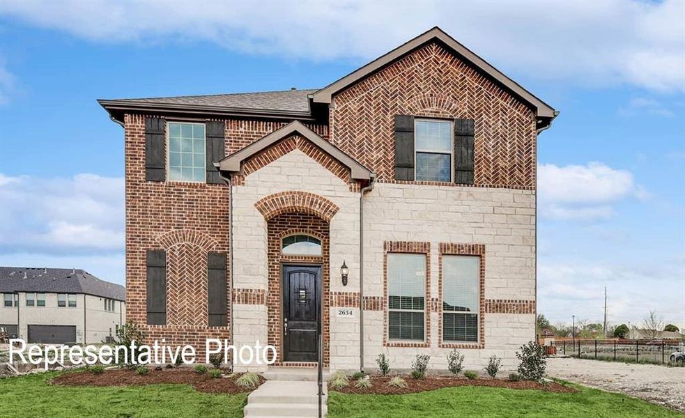 View of front of property featuring a front yard