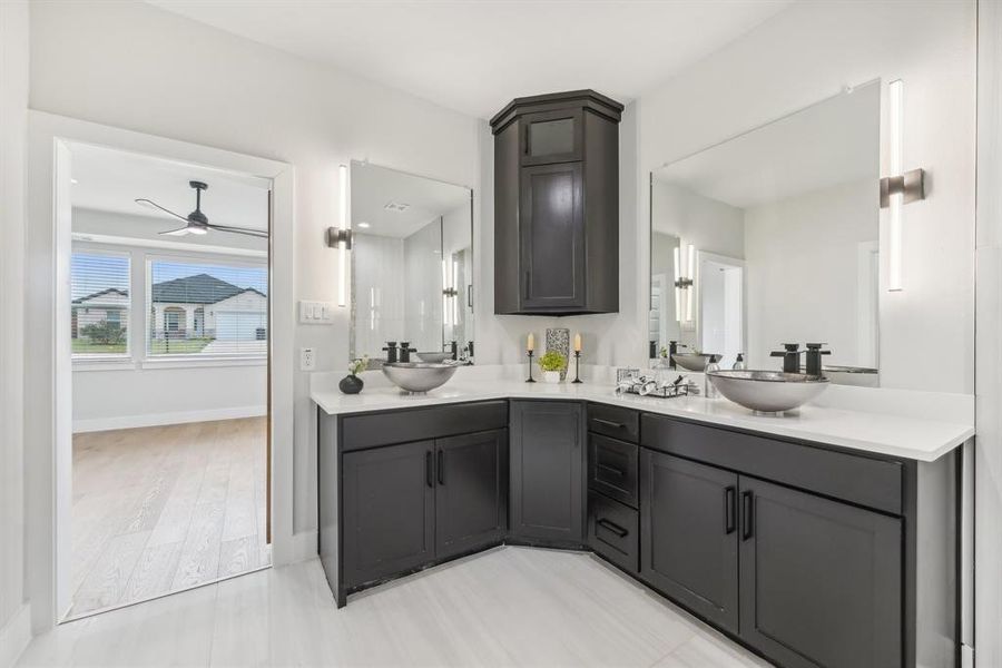 Bathroom with ceiling fan, hardwood / wood-style flooring, and vanity