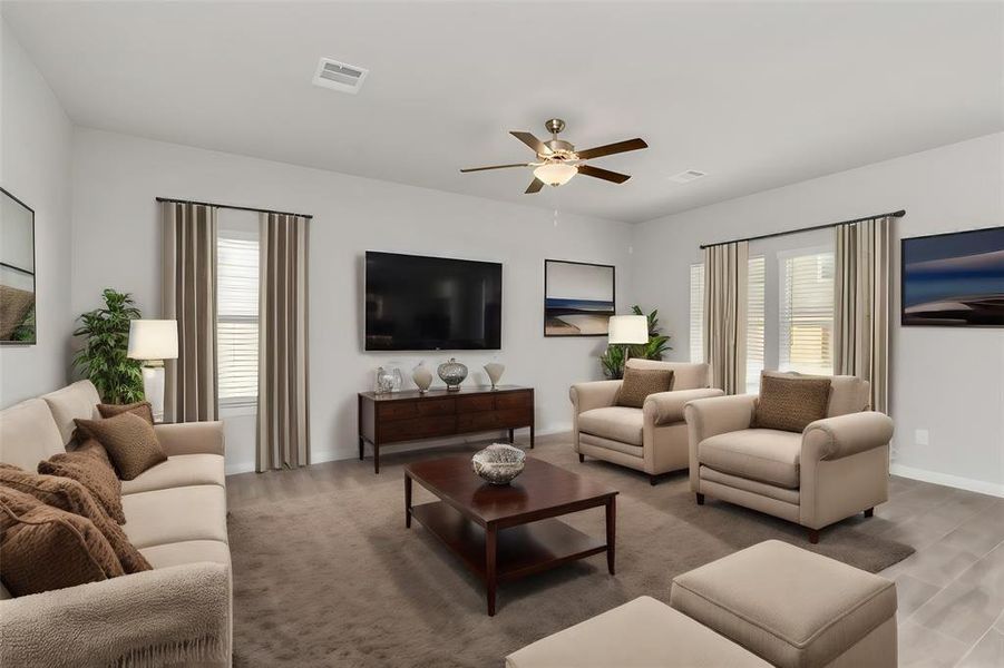 Another perspective of the inviting living room showcases its versatility and ample space for various furniture configurations. The room’s layout is ideal for creating cozy conversation areas, while the large windows ensure a bright and cheerful environment. This space, with its timeless design and comfortable seating options, is perfect for unwinding with family or hosting friends. **This image is from another Saratoga Home with similar floor plan and finishes, not the June floorplan.**