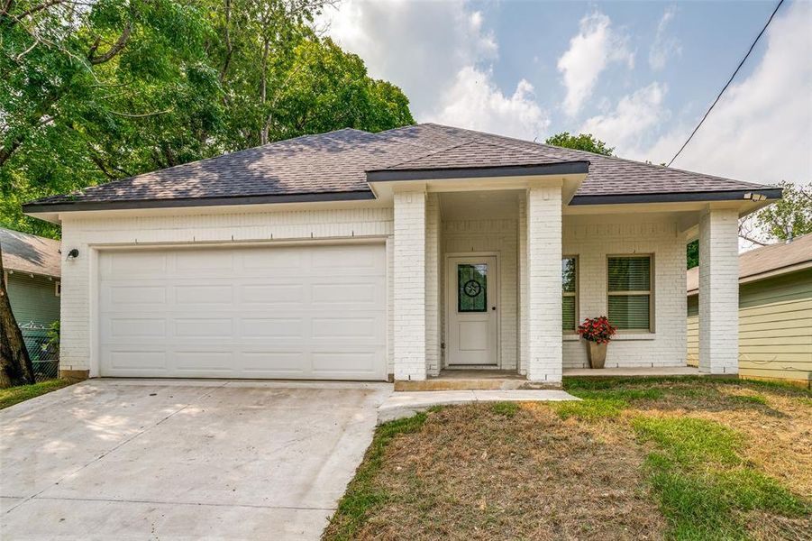 Single story home featuring a garage