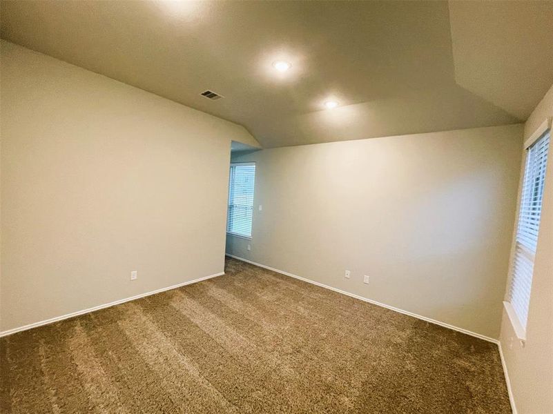 Master bedroom features a vaulted ceiling!