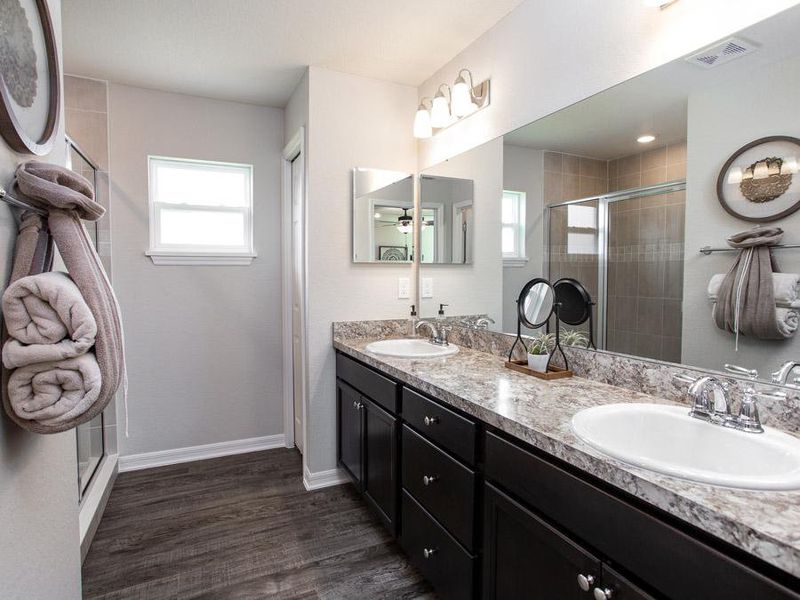 Your suite is complete with a private and spacious en-suite bath - Begonia home plan by Highland Homes