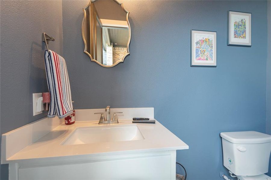 Bathroom featuring vanity and toilet