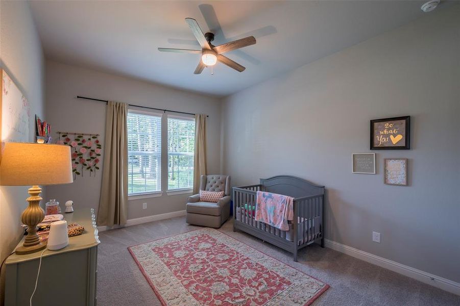 This secondary bedroom measures 14x12 and shares a full bath with an adjacent secondary bedroom.