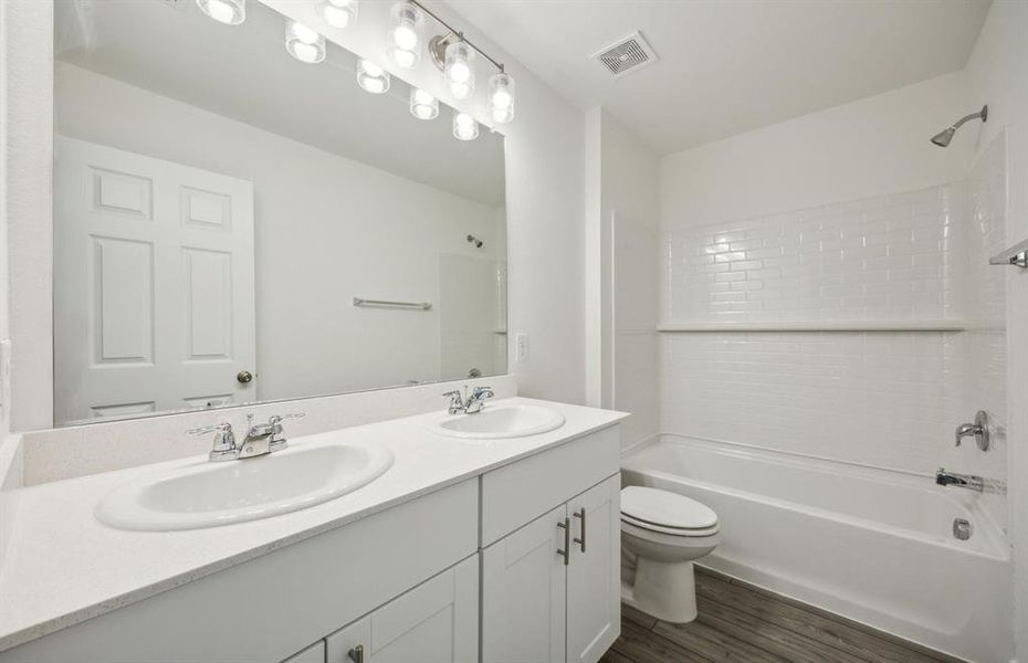 Spacious secondary bathroom with premium finishes  *real home pictured